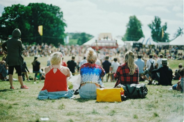 Crowded outdoor concert in rural setting